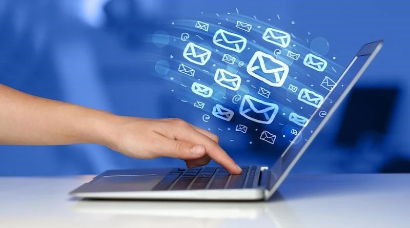 Laptop with flying email icons